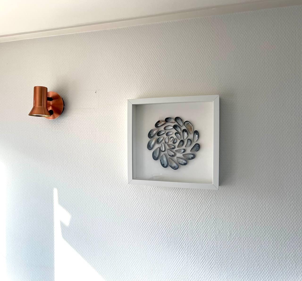 Spiral Art for Cozy Bedroom Interior Decor with North Sea Shells